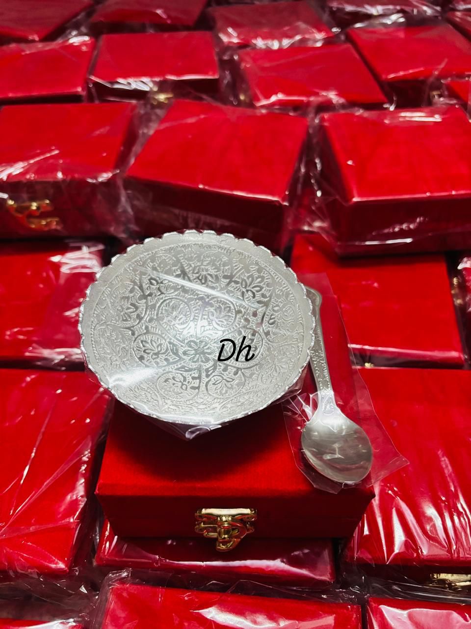 Silver bowl on a red box for housewarming,diwali ,home pooja return gifts