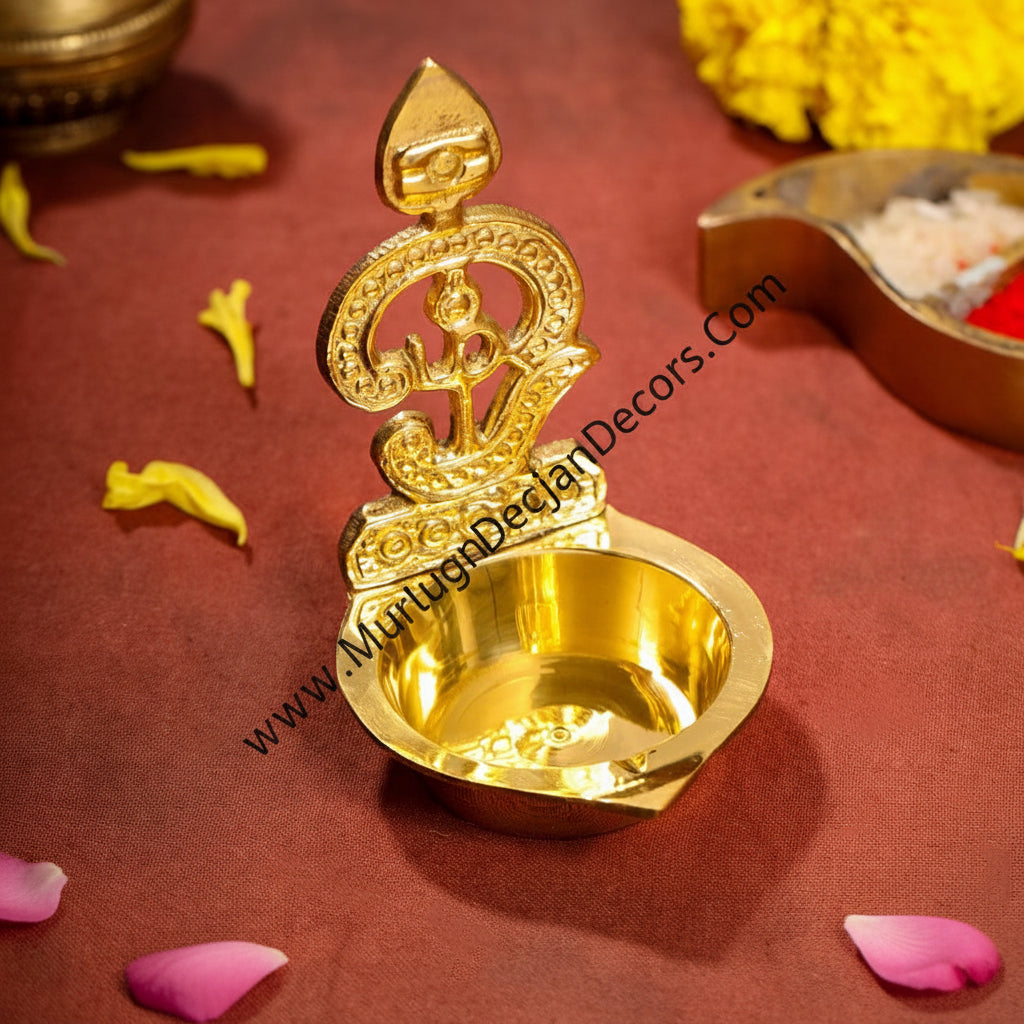 Buy Brass OM Muruga Villakku Vel Diya Oil Deepam – a sacred brass lamp perfect for pooja return gifts, housewarming & Navratri Golu favours. Ships across USA