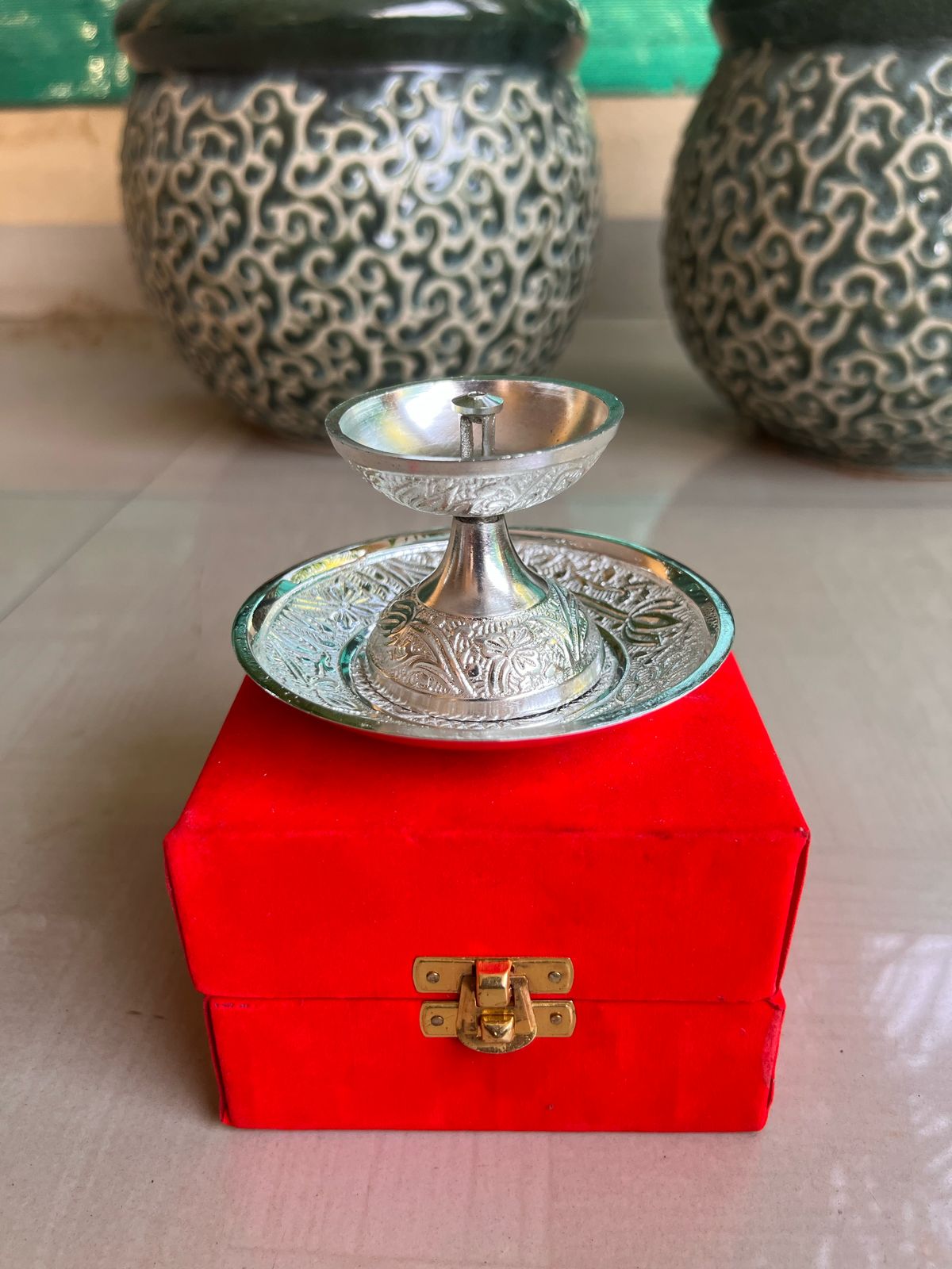 Shop German silver Akhand diya with Plate in Red velvet gift box for housewarming and Diwali return gifts at Murugan Decors 