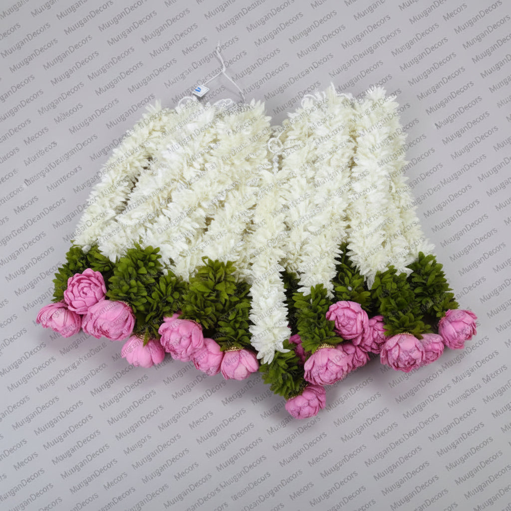 Decorative lotus buds hanging with white flowers, green leaves, and pink flowers  for housewarming decor