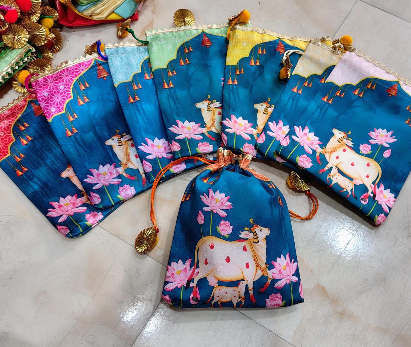 Silk Pichwai Potli Gift Bag with Sacred Cow Kamdhenu and Pink Lotus Print on Teal Blue Background – Housewarming Return Gift Bag – MuruganDecors USA