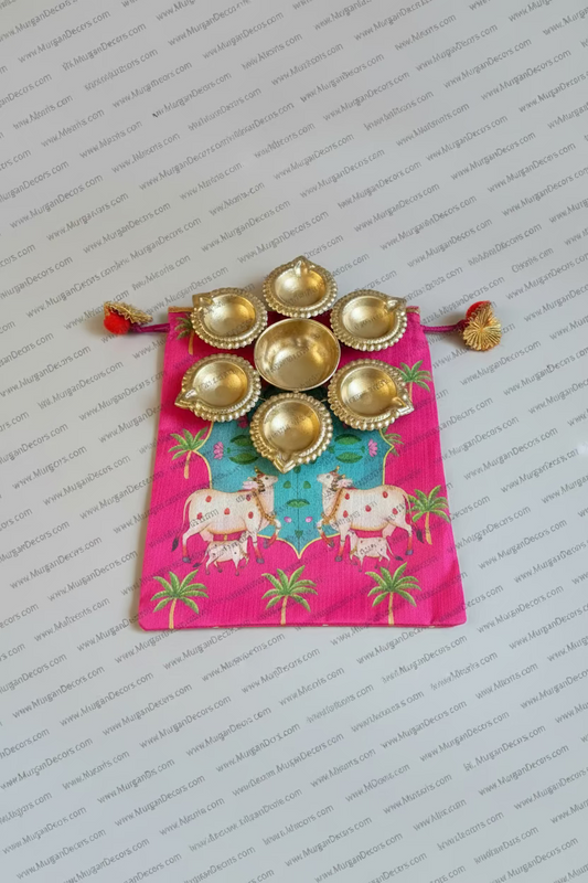 Shop metal Urli Diya with pichwai Potli bag for traditional return gifts in USA at Murugandecors 